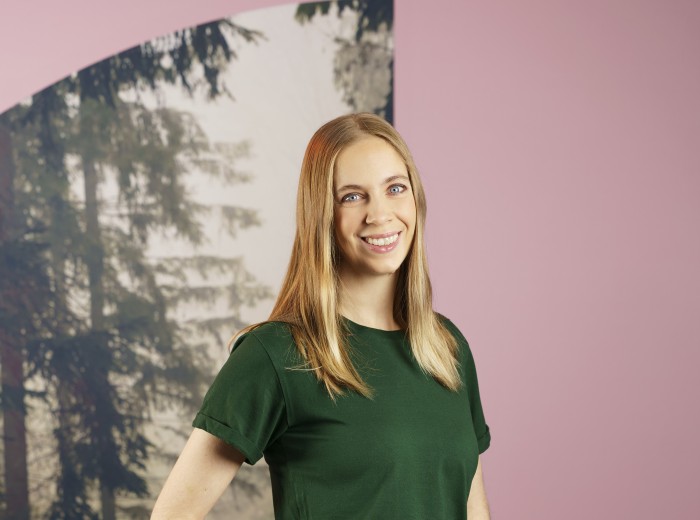 woman in green t-shirt and smiling